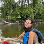 Paris Velasquez conducts fieldwork on a lake via jonboat. on July 5, 2024